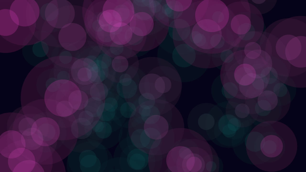 A simplistic image displaying a series of green and blue circles against a black background. The abstract pattern lacks clear context or significance