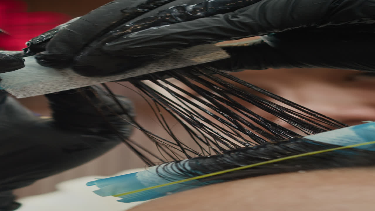 Hands of Barber Doing Hair Perming to Man