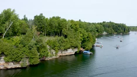 Aerial-Drone-Flight-Above-a-Boat-Parade-on-a-Lake-in-the-USA-during-the-Summer