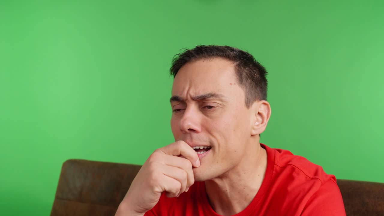 Excited sports fan celebrating goal on green screen