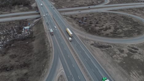 a car interchange with an overpass on a cloudy spring evening in the woods