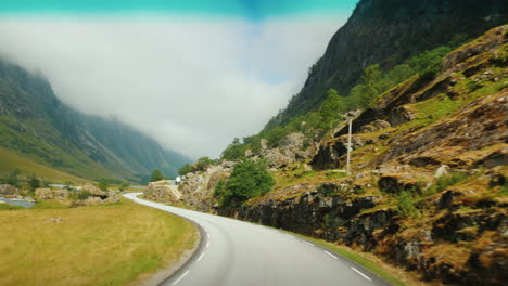 go along the scenic road among the mountains of norway first-person view