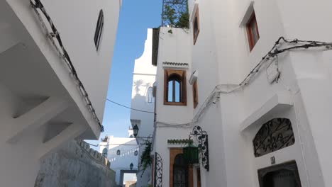 Gleaming-white-facades-Moroccan-homes-nestled-within-Kasbah-fortifications,-Tangier-Medina