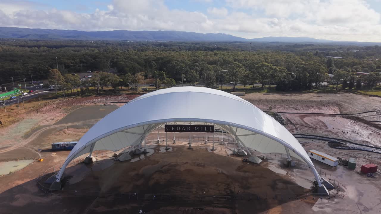 Medium closeup parallax half finished stadium dome at abandoned construction site in Morisset, NSW