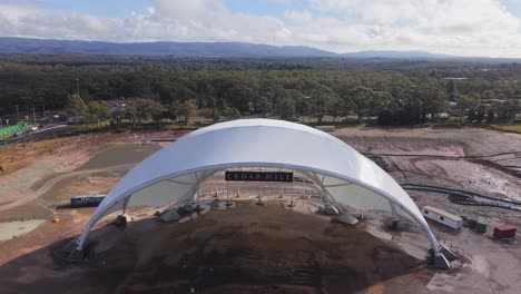 medium closeup parallax half finished stadium dome at abandoned construction site in morisset, nsw