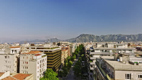 Palermo-Italy-Aerial-v8-low-tracking-shot-drone-flyover-the-city-capturing-residential-cityscape-and-mountain-landscape-on-the-skyline-at-daytime---Shot-with-Mavic-3-Cine---May-2023