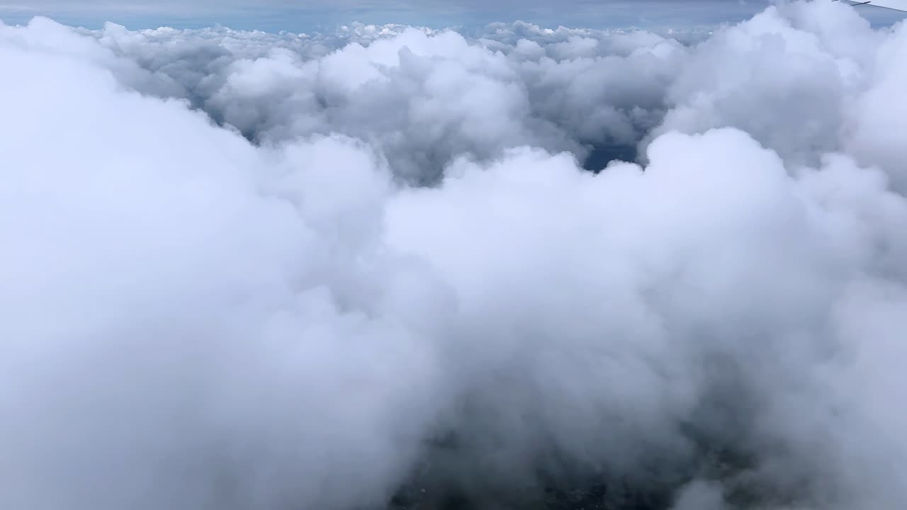Thick clouds in the sky, creating a serene and dreamy atmosphere, aerial view