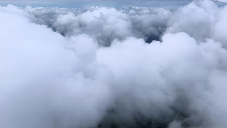 thick clouds in the sky, creating a serene and dreamy atmosphere, aerial view