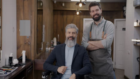 happy customer and barber at a hair salon