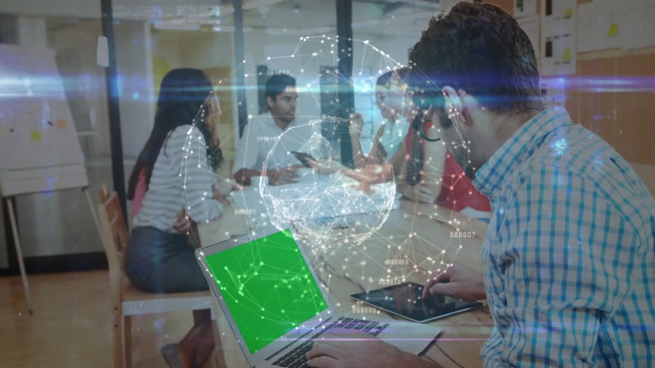 Man typing laptop in tech meet turning smiling to cam for project globe overlay drifting across