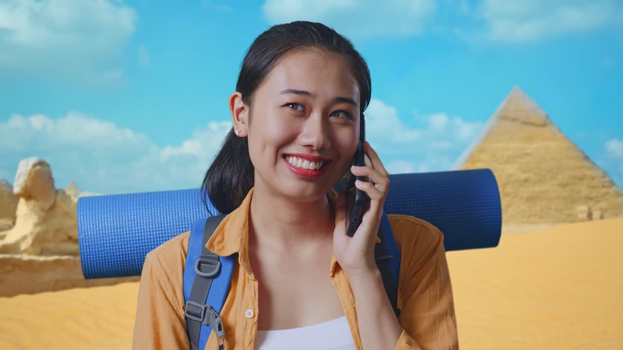 Woman on vacation in Egypt talking on her phone