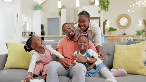 happy, black family on sofa