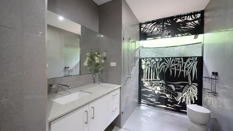 tropical villa-style home with a luxury modern bathroom, featuring sleek fixtures and a spacious layout