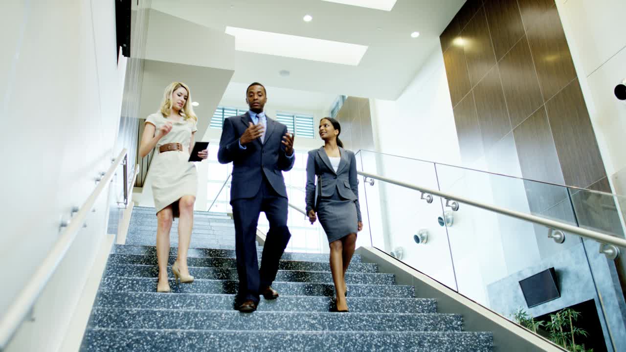 Multi ethnic business people in modern office building