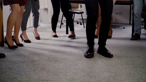 happy african american ceo dancing with friends at casual office party. colleagues share fun activity at workplace 4k