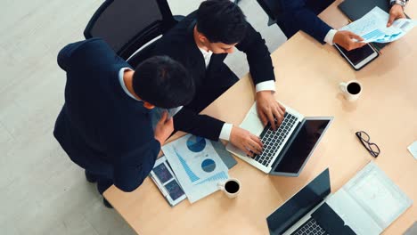 Business-people-group-meeting-shot-from-top-view