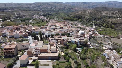 aerial approach to cadiar, in the alpujarras area, granada, spain. sea in the background