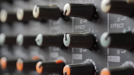 Old-dusty-audio-console-closeup.-Changing-lighting