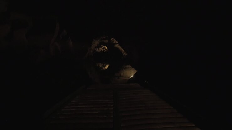 Touristic boat traveling in karst cave Trang An Vietnam