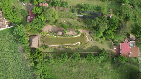 an enchanting aerial view captures a serene river, set against the backdrop of a tourism house in etla, oaxaca