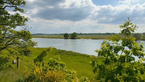 peaceful limburg coutryside river landscape with a summer breeze a beautiful cloud