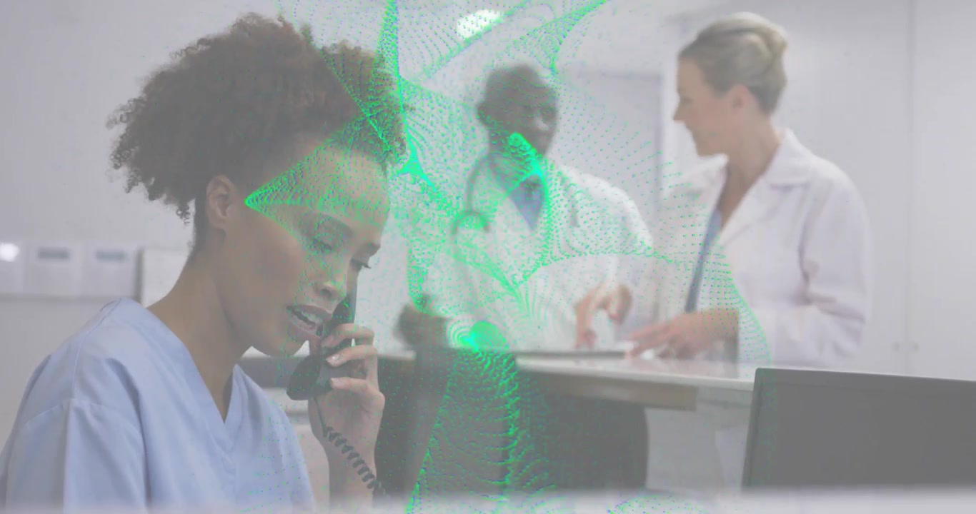 Medical Receptionist Talking on Phone with Doctors in Background