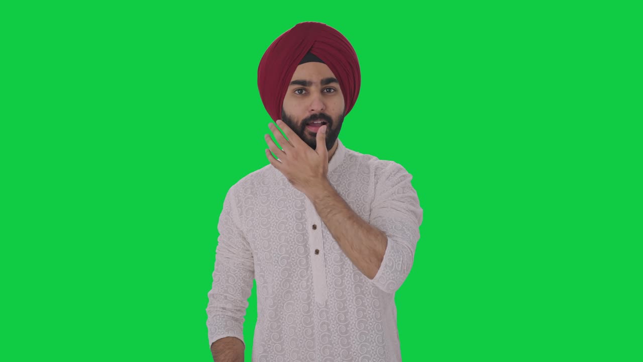 feliz hombre indio sikh preparándose para salir pantalla verde