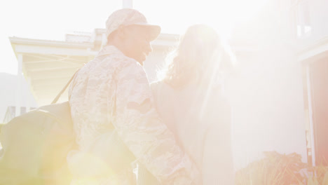 video of caucasian wife and african american soldier husband back home together