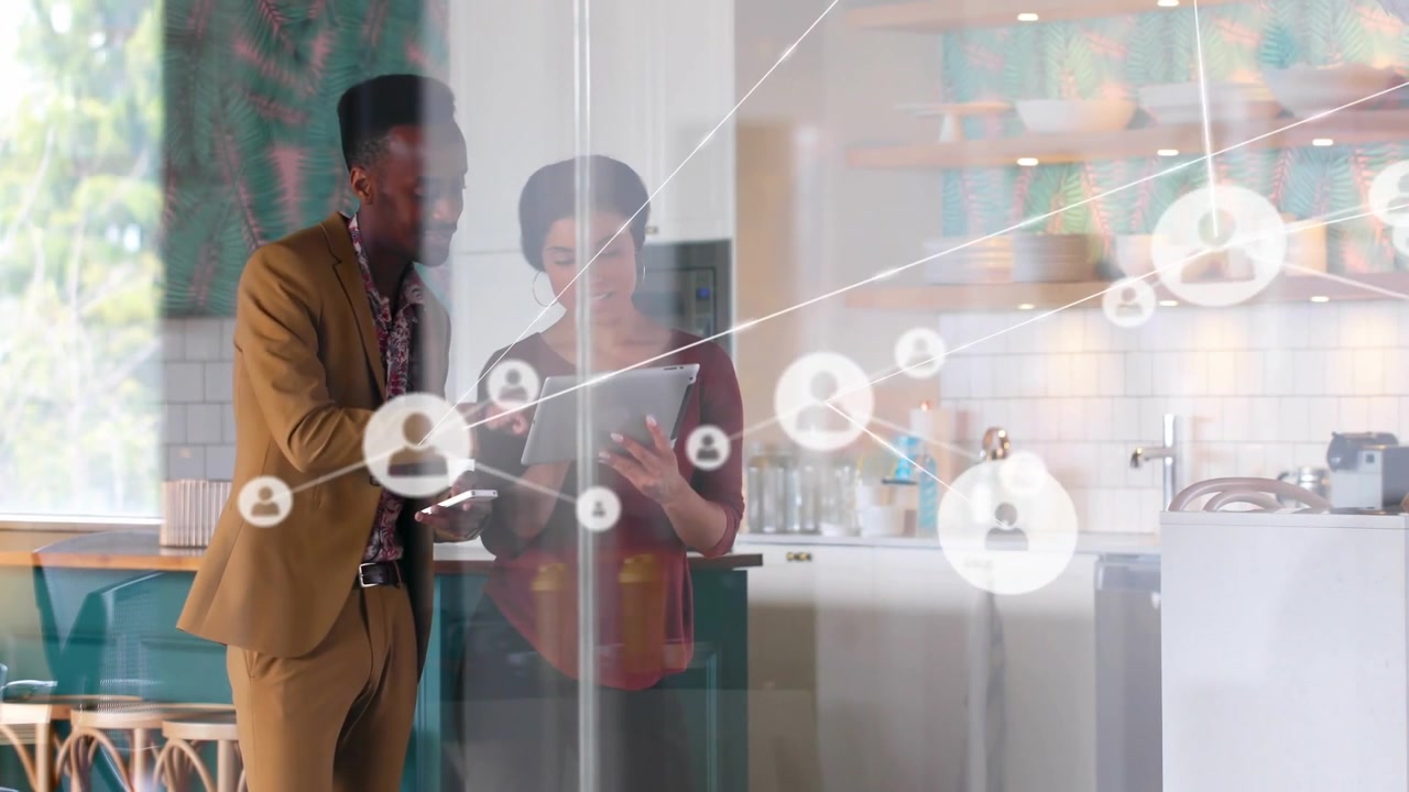 Network graphic appearing from right, expanding, obscuring team holding tablet showing user links