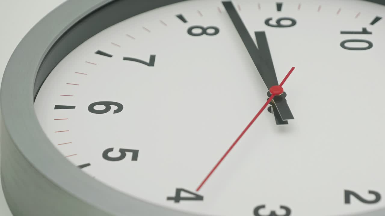 Truck shot of time-lapse gray clock with black arrows shows motion the time speed up from 8.00 a.m. to 9.00 a.m., How time flies concept.