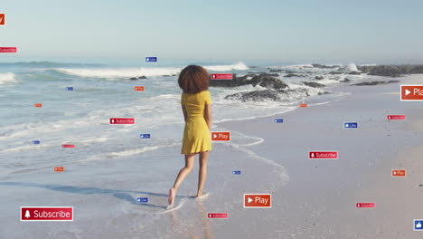 Walking-on-beach,-woman-surrounded-by-social-media-buttons-animation