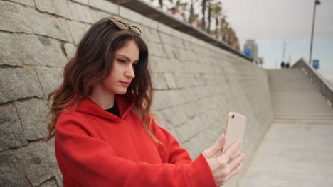 young girl taking selfie with smartphone