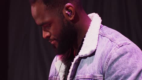 musician playing keyboard on stage