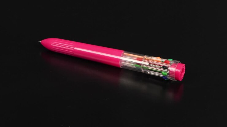 Pen with colored refills on a black. Ten different colors. Side view. Loop motion. Rotation 360.