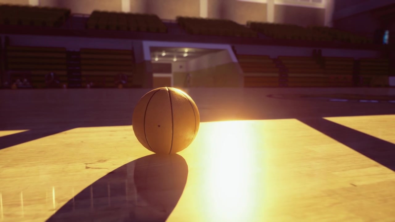 Pallone da basket luminoso crea un intenso contrasto su un campo vuoto al tramonto