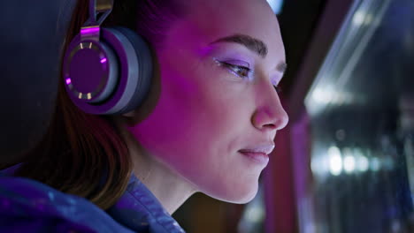 teenager face trendy makeup looking on showcase close up. woman listening music