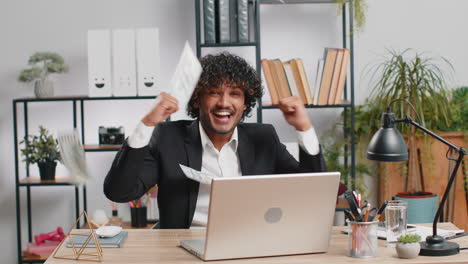 money cash dollar rain falling on adult office business man celebrating success winning career grow