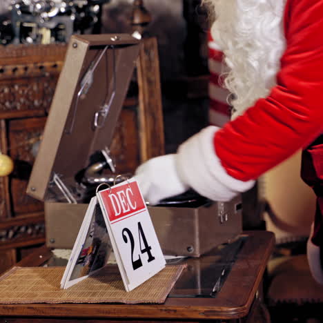 santa claus is turning a calendar page. close up of santa claus with calendar. feast is coming.christmas eve video.