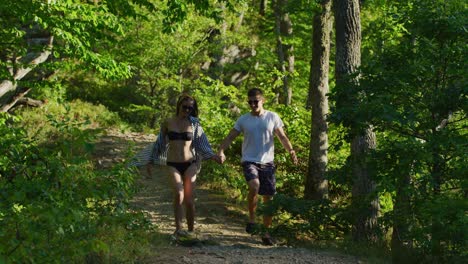 couple running in a forest park