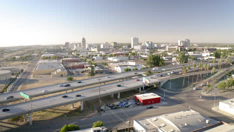aerial view of a city with freeway and skyline