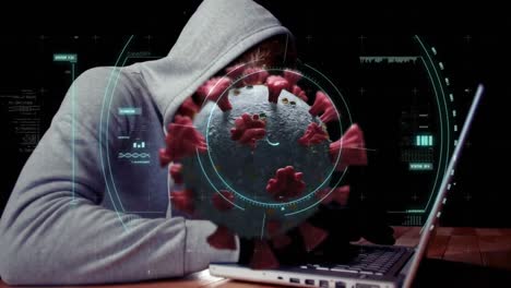 animation of of macro covid19 cell over man wearing hoodie, using a laptop