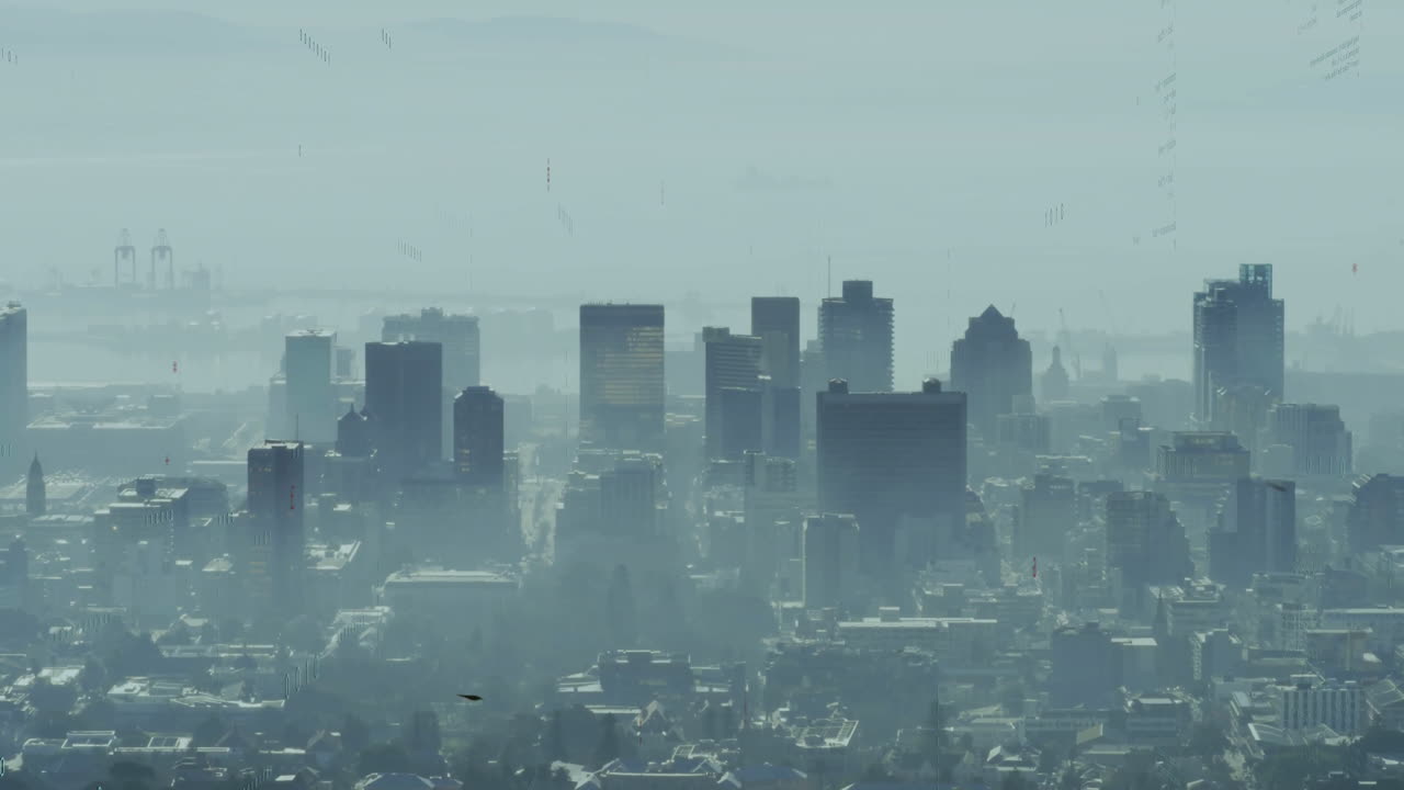Tall buildings in foggy cityscape with distant mountains in background animation