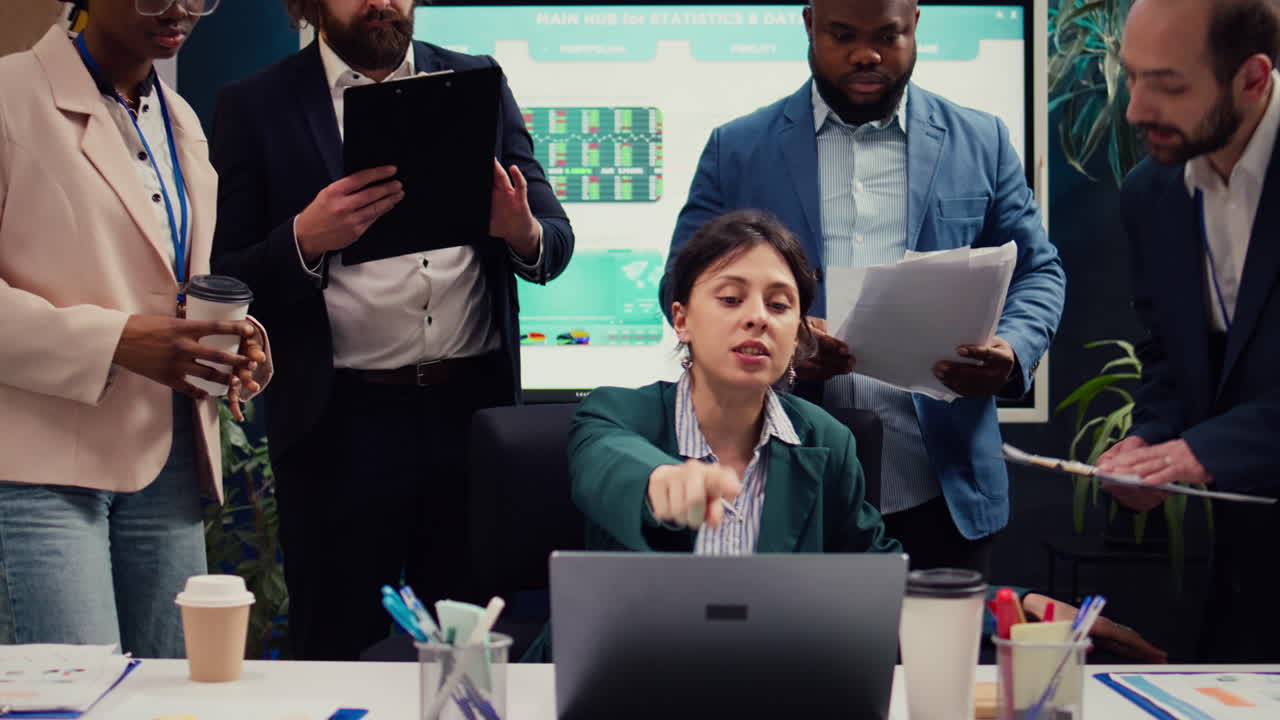 Irritated difficult boss getting angry at her employees team