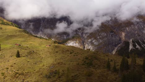 Scenic-aerial-view-of-hill-and-houses-in-Hochkonig,-pull-back-shot,-day