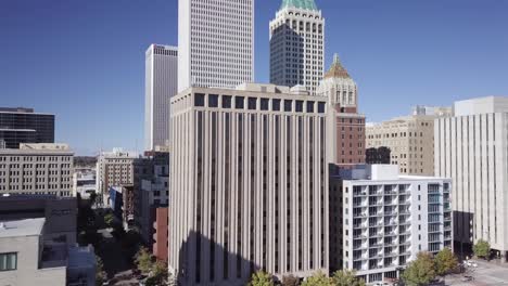 flying through buildings in downtown tulsa city streets