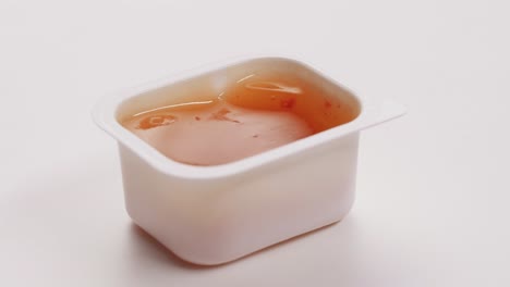 sweet chili sauce in a disposable container