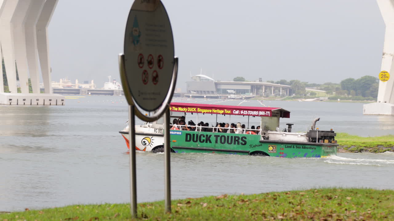 Duck tours tourist boat with wheels driving into water, Singapore