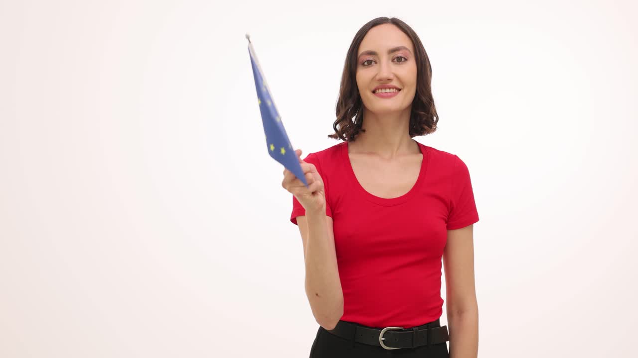 Smiling woman holding European Union flag