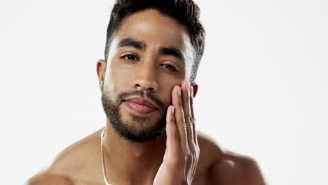 face, hand and man in studio for skincare