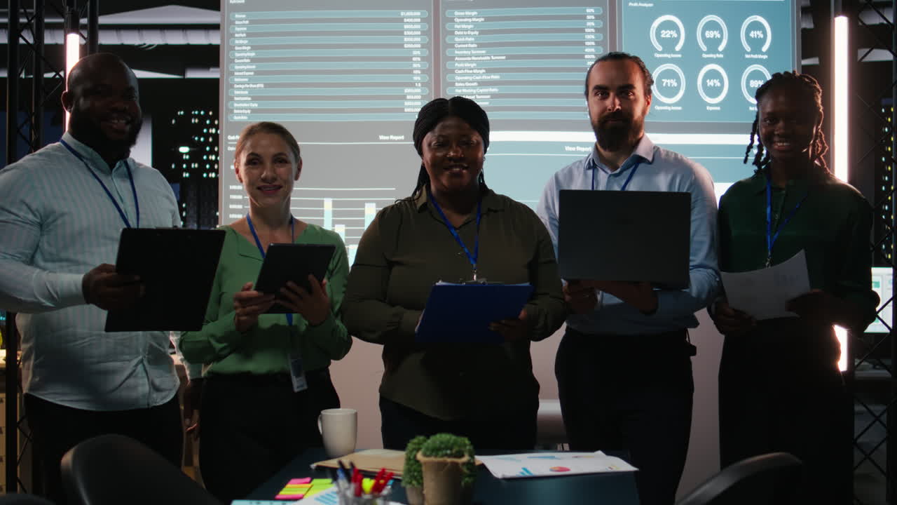 Portrait of team members discuss insight details and progress on a new project